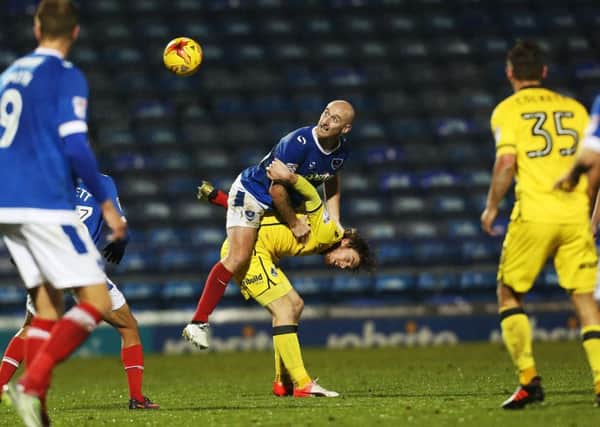Drew Talbot wins the ball in the air for Pompey against Bristol Rovers. Picture: Joe Pepler