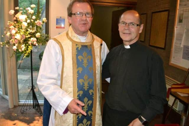 PRIDE The Rev Peter Lambert, right, after he was licensed as assistant deanery priest by Bishop Christopher Foster, left