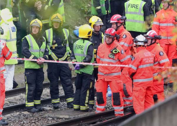 The scene after a tram overturned in Croydon, south London.  Picture: Steve Parsons/PA Wire