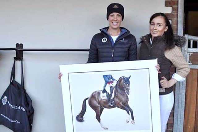 Bethany Vere shows her picture of Valegro to gold medal winner Charlotte Dujardin