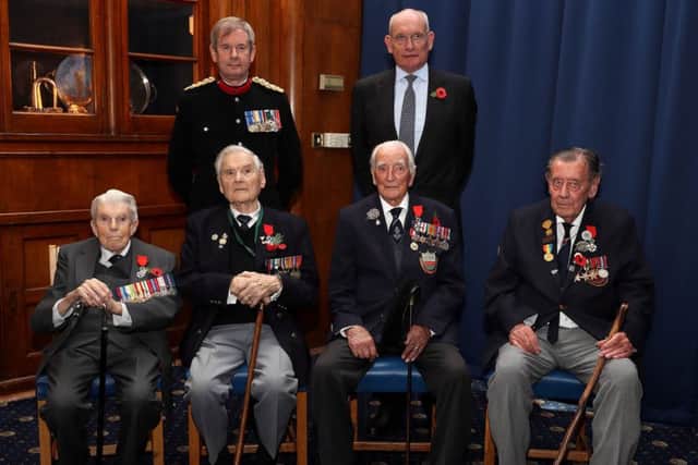 From left, Lieutenant Commander Fredrick Davenport, 95, from Drayton, Tony Fairminer, 91, of Midhurst, Andrew Bramley, 93, of Colden Common and Ron Smith, 91, from Rustington. They are pictured with the Deputy Lord Lieutenant of Hampshire and the French Consul Francois Jean