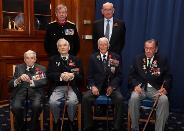 From left, Lieutenant Commander Fredrick Davenport, 95, from Drayton, Tony Fairminer, 91, of Midhurst, Andrew Bramley, 93, of Colden Common and Ron Smith, 91, from Rustington. They are pictured with the Deputy Lord Lieutenant of Hampshire and the French Consul Francois Jean