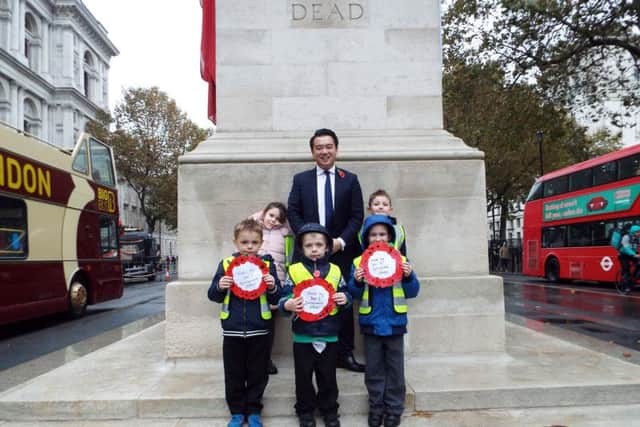 TRIBUTE Alan Mak with pupils from Springwood Infant School at the Cenotaph in Whitehall