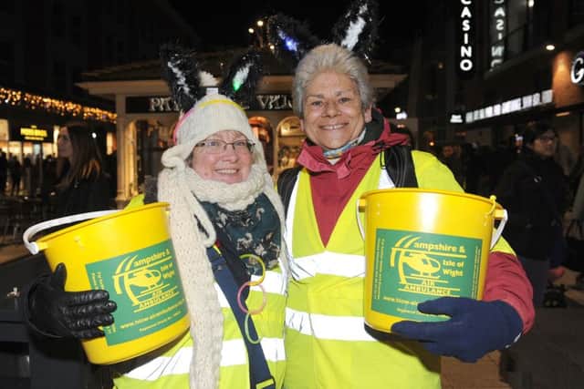 Maria Cook, left, and Debbie Donald wrapped up warm collecting for Hampshire and Isle of Wight Air Ambulance.Picture: Sarah Standing (161551-2356)