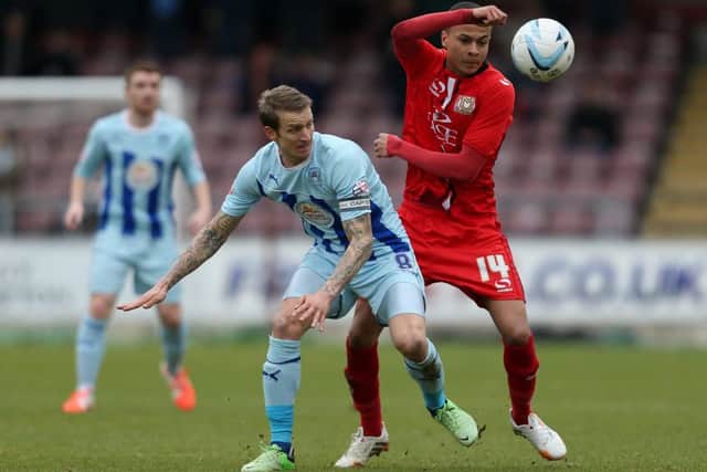 Carl Baker in action for Coventry two years ago against future MK Dons team-mate Dele Alli, right  now a Spurs midfielder and England international