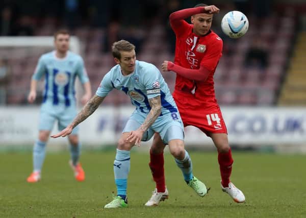 Carl Baker in action for Coventry two years ago against future MK Dons team-mate Dele Alli, right  now a Spurs midfielder and England international