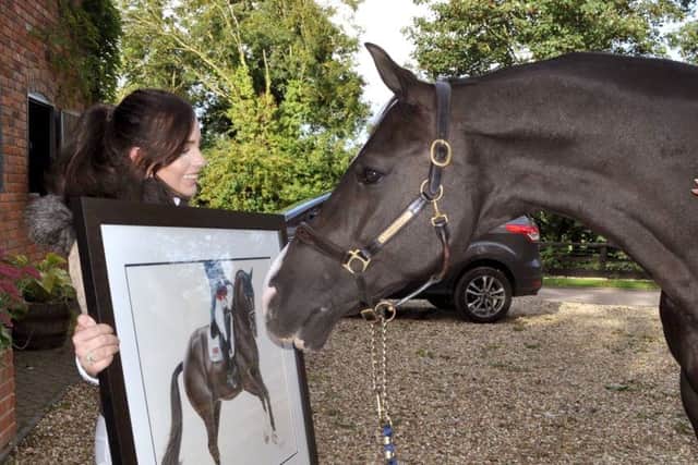 Bethany Vere shows her picture to Valegro
