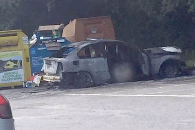 The BMW that Chad Dendy set on fire while its owner, Tom Withey, was inside