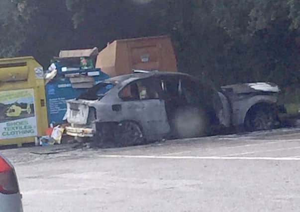 The BMW that Chad Dendy set on fire while its owner, Tom Withey, was inside