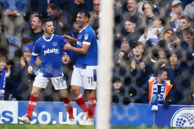 Gary Roberts celebrates with Conor Chaplin after giving Pompey a first-half lead over Mansfield Picture: Joe Pepler