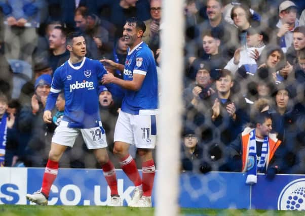 Gary Roberts celebrates putting Pompey ahead from the spot with Conor Chaplin Picture: Joe Pepler