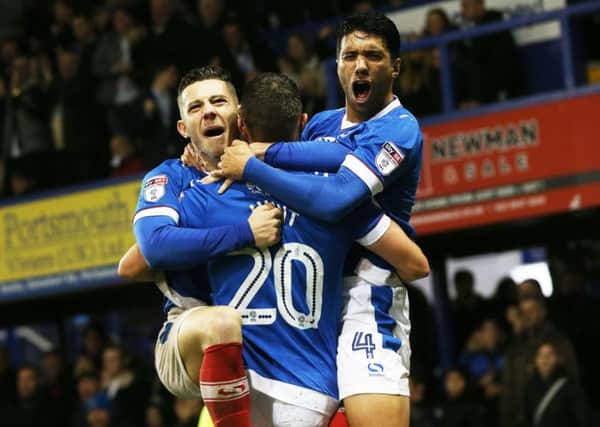 Noel Hunt, centre, celebrates his goal with Conor Chaplin and Danny Rose Picture: Joe Pepler