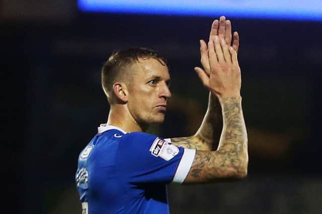 Carl Baker applauds the Fratton faithful after his late double put the gloss on a 4-0 win over Mansfield   Picture: Joe Pepler