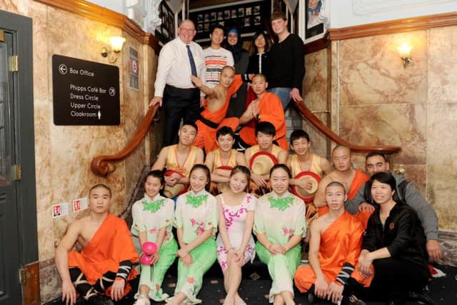 Back from left, Steve Frampton, principal of Portsmouth College with students, second and third left, Timothy Wong ), Amna Khan and Robert Sainsbury with performers fromt the the Chinese State Circus
Picture: Sarah Standing (161557-2734)