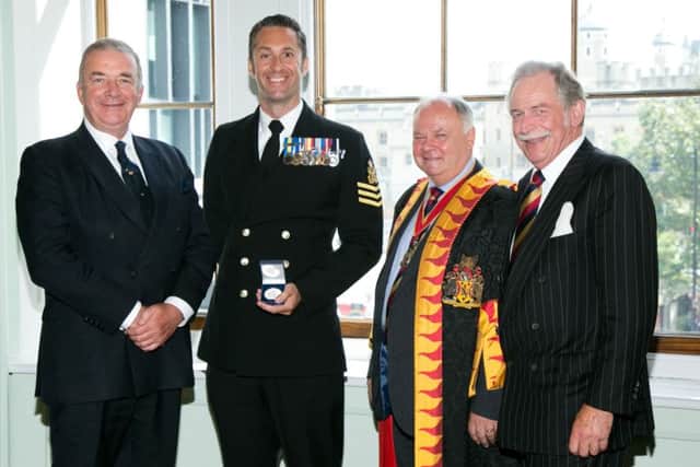 Petty Officer Steve Munday picking up the 2016 Fuellers Award. He was honoured at the Albert Hall for his work fundraising for the Royal British Legion