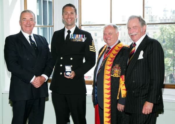 Petty Officer Steve Munday picking up the 2016 Fuellers Award. He was honoured at the Albert Hall for his work fundraising for the Royal British Legion