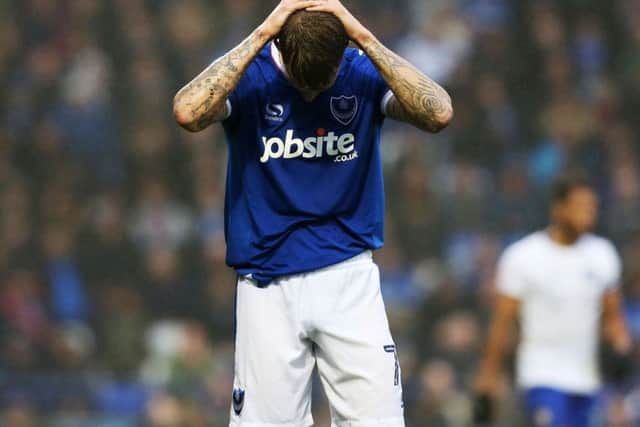 Carl Baker holds his head in his hands after a chance goes begging against Mansfield Picture: Joe Pepler