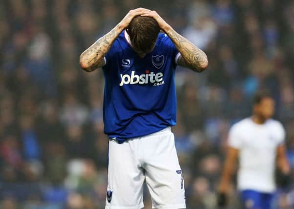 Carl Baker holds his head in his hands after a chance goes begging against Mansfield Picture: Joe Pepler
