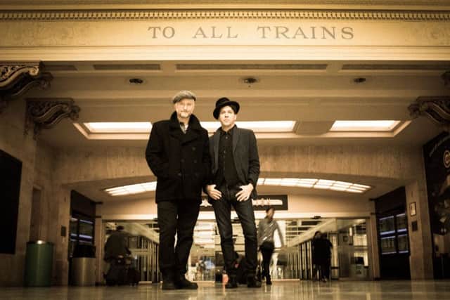 Billy Bragg (left) and Joe Henry on their railroad tour from Chicago to Los Angeles