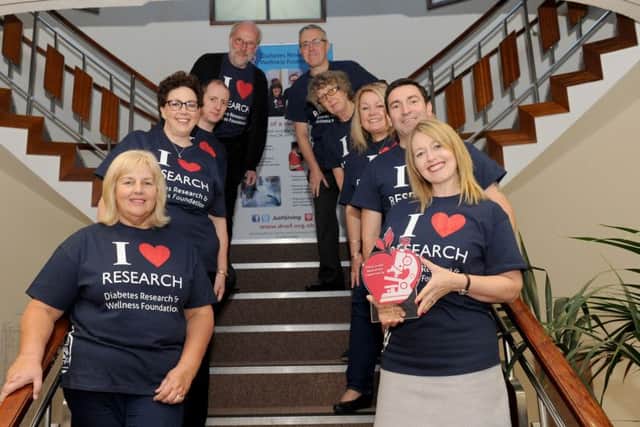 Back from left, Mike Short, accounts manager, Steve Lille, office manager, Richie Troughton, publishing editor, Jenny Diment, office administrator, Claire Levy, community fundraiser, Sarah Brown, research administrator, Debra Peett, network administrator, Lee Calladine, event co-ordinator and Sarah Tutton, CEO.Picture: Sarah Standing (161549-1932)