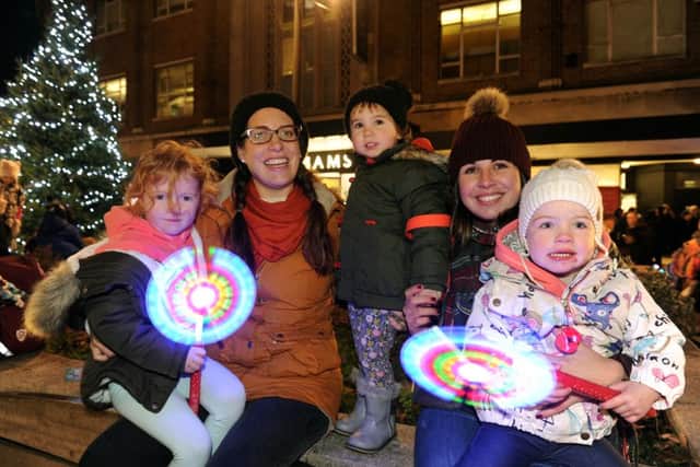 Pictured at the Palmerston Road lights switch-on are: (l-r) Isla Gray (4) with family friend Amy Baines (29) from Southsea, Asha Baines (2), Hannah Hodgson (28) with her daughter Willow Hodgson (2) from Drayton.Picture: Sarah Standing (161547-1799) PPP-160911-202006001