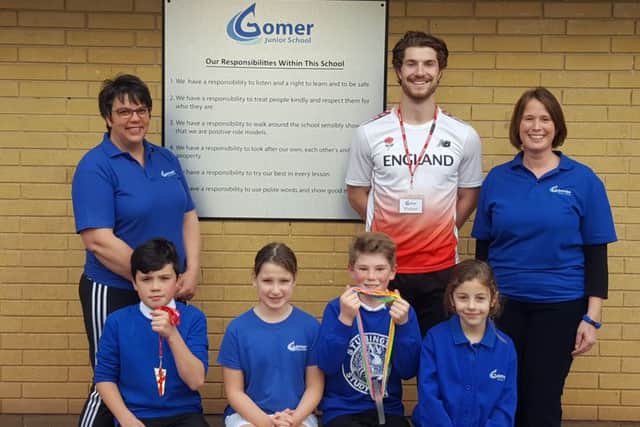 Athlete Kieran Showler-Davis with Sharon Toone, head teacher Georgina Mulhall and pupils Michael Fitz-Earle, Sophia Hewitt, Tom Harris and Sophie Richards