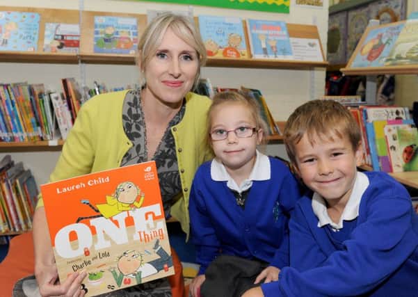 Author Lauren Child with Lola Measor and Charlie Richardson and her new book One Thing 
Picture: Sarah Standing (161559-6568)