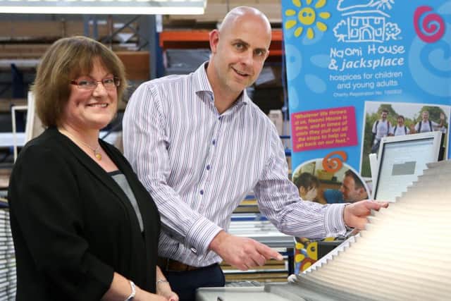 Sarah Hudson from Naomi House meets with Andrew Briggs at Thomas Sandersons manufacturing centre in Waterlooville