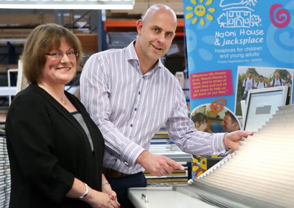 Sarah Hudson from Naomi House meets with Andrew Briggs at Thomas Sandersons manufacturing centre in Waterlooville