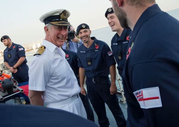 HRH The Prince of Wales shares a joke with the ships company of HMS Middleton. Picture: PO G Granger US Navy