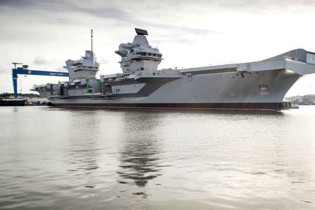 Stock Picture:The UK's largest ever warship, HMS Queen Elizabeth, has today been successfully floated out of the dock in which she was assembled.In an operation that started earlier this week, the dry dock in Rosyth near Edinburgh was flooded for the first time to allow the 65,000 tonne aircraft carrier to float. It then took only three hours this morning to carefully manoeuvre HMS QUEEN ELIZABETH out of the dock with just two metres clearance at either side and then berth her alongside a nearby jetty.Teams will now continue to outfit the ship and steadily bring her systems to life in preparation for sea trials in 2016.  The dock she vacates will be used for final assembly of her sister ship, HMS PRINCE OF WALES, which will begin in September.The float out of HMS QUEEN ELIZABETH comes just 13 days after the vessel was named by Her Majesty the Queen in a spectacular ceremony.HMS QUEEN ELIZABETH and HMS PRINCE OF WALES are being delivered by the Aircraft Carrier Alliance, a unique partnership between