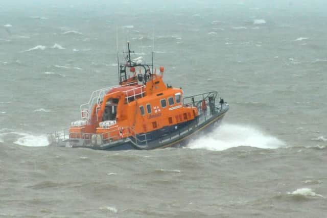 Birling Gap Safety Boat Open Day. April 9th 2012 E15145NThe Newhaven Lifeboat returns to base after exercise with Coastguard helicopter is called off. SUS-150113-100140001
