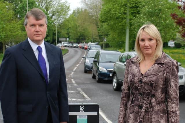 Leader of Fareham Borough Council Cllr Sean Woodward and Gosport MP Caroline Dinenage with traffic that would be alleviated when a Stubbington bypass is built. ENGPPP00120130524184910