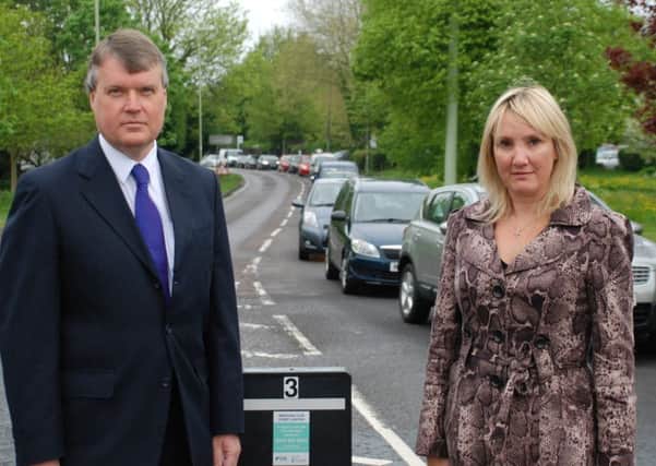 Leader of Fareham Borough Council Cllr Sean Woodward and Gosport MP Caroline Dinenage with traffic that would be alleviated when a Stubbington bypass is built. ENGPPP00120130524184910