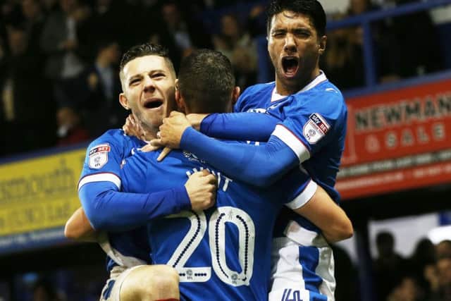 Noel Hunt, centre, celebrates his first goal for Pompey, with Conor Chaplin and Danny Rose during Saturdays 4-0 win against Mansfield