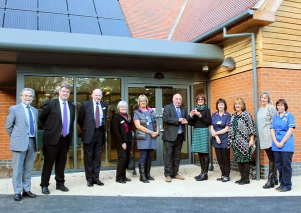 Rowans Living Well Centre has opened its doors. Building contractor Bill Richardson of Richardsons (Nyewood) Ltd hands over the keys to the building to honorary chairman of trustees Elizabeth Emms