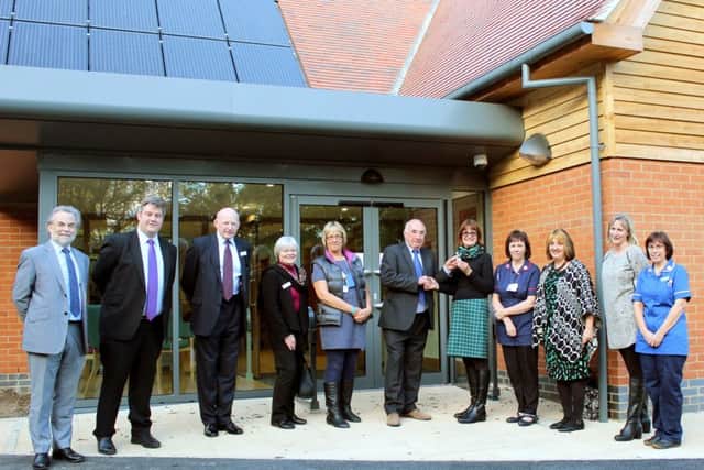 Rowans Living Well Centre has opened its doors. Building contractor Bill Richardson of Richardsons (Nyewood) Ltd hands over the keys to the building to honorary chairman of trustees Elizabeth Emms