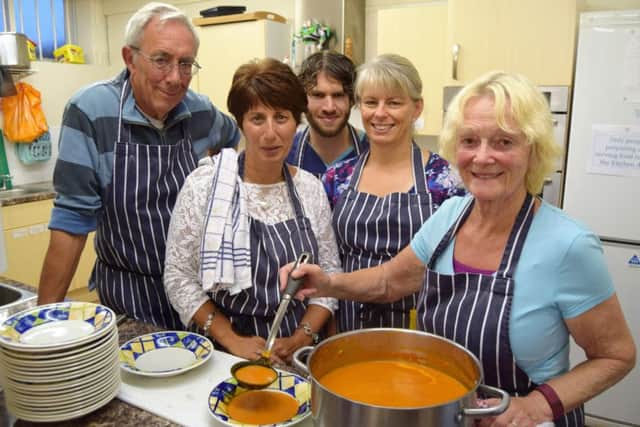 Volunteers helping to serve food to the needy Mike Phyall, Marina Stafford, David Le Poidevim, Fiona Buck and cook Eileen Phyall Picture: Tom Cotterill