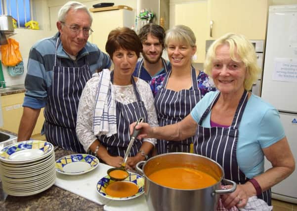 Volunteers helping to serve food to the needy Mike Phyall, Marina Stafford, David Le Poidevim, Fiona Buck and cook Eileen Phyall Picture: Tom Cotterill