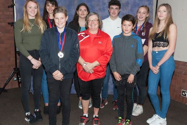 City of Portsmouth coach Bronwin Carter with members of her successful throwing squad. Picture: Paul Smith