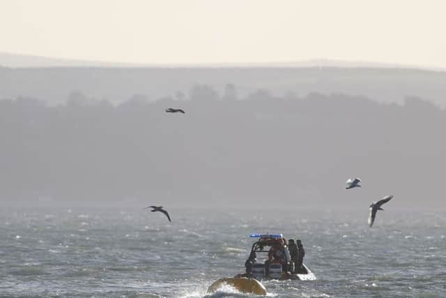 The Royal Navy tow out a second World War bombfound while dredging the harbour in Portsmouth,
Picture: Steve Parsons/PA Wire