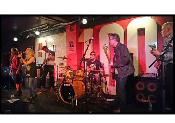 The Hughe Fighters at the 100 Club in London. From left, guest backing vocalist Helen Jarvis, lead singer Mary Pearson, Joe Walker on lead guitar, Russell Mogridge on drums, Tim Clark on bass guitar and Carl Walker on rhythm guitar