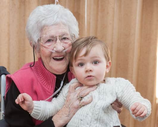 Elizabeth Smith celebrated her 100th birthday at the Alexandra Bowls Club. Here she is with her great-great grandson Albert Perkins, 15 months. Picture: Keith Woodland.
