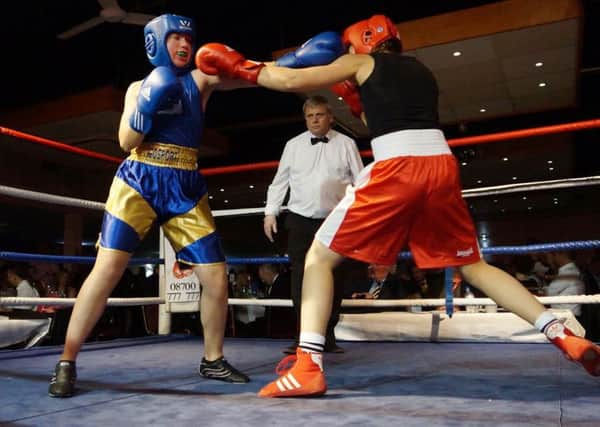 Rosie Ratzer, left, in action for Gosport Boxing Club at last year's show