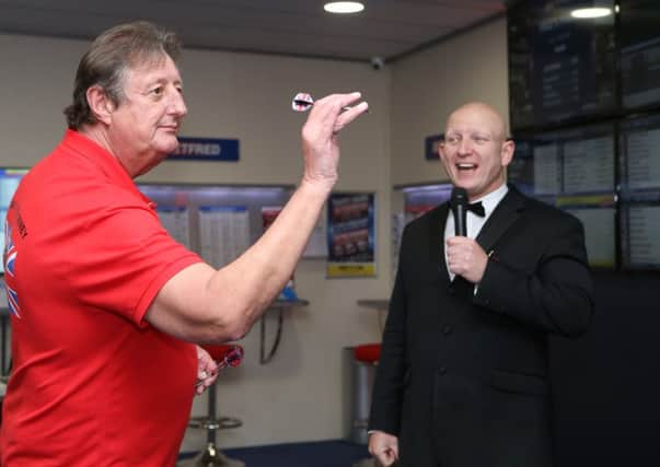 Eric Bristow with MC Paul Booth