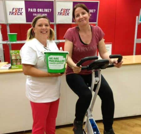 Kelly Punter, left, and Nicola Lloyd, from Argos, raising money for Macmillan Cancer Support