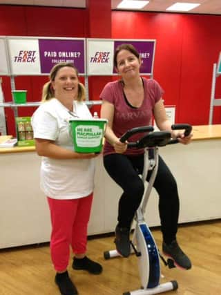 Kelly Punter, left, and Nicola Lloyd, from Argos, raising money for Macmillan Cancer Support