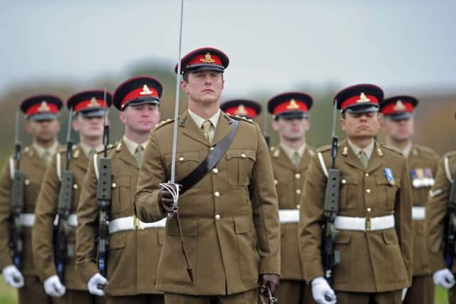 Soldiers of 16 Regiment Royal Artillery take part in a re-unification parade of their regiment and associated batteries at Thorney Island