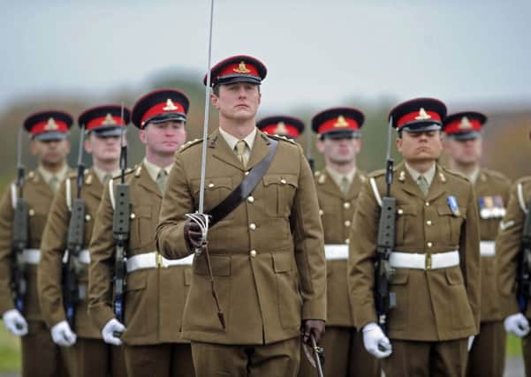 Soldiers of 16 Regiment Royal Artillery take part in a re-unification parade of their regiment and associated batteries at Thorney Island
