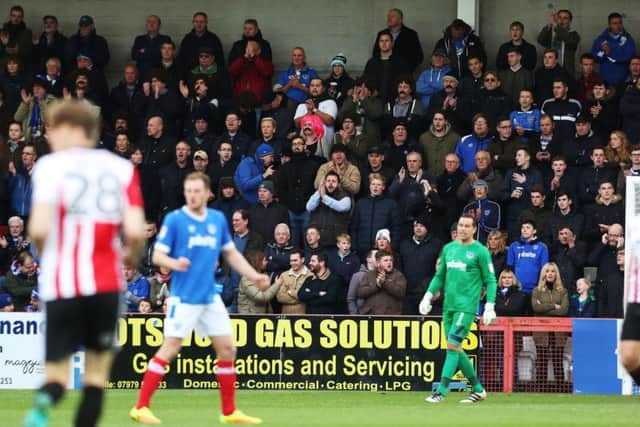 Paul Cook saluted Pompey's travelling support. Picture: Joe Pepler